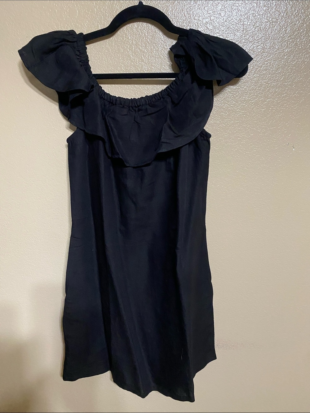 Tommy Bahama Black Ruffle Off-Shoulder Mini Dress or not.